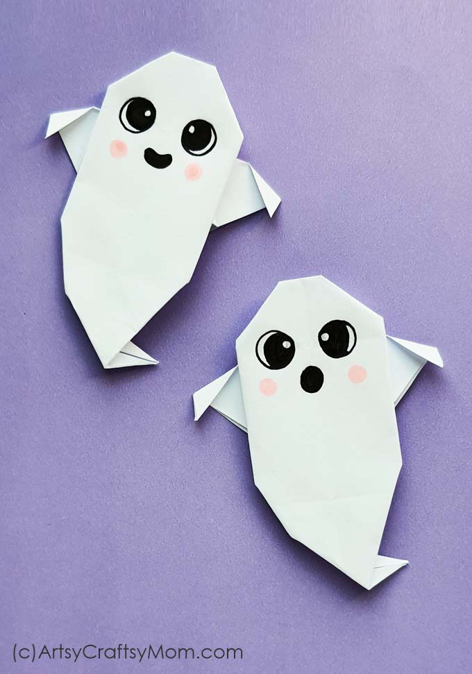 white origami ghost crafts with friendly faces