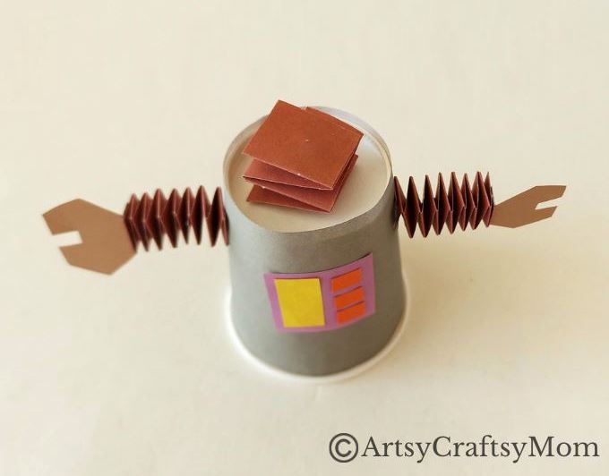 Here's a cute little paper cup robot craft for kids to make and play with! A fun craft that shows children how to upcycle ordinary household items!