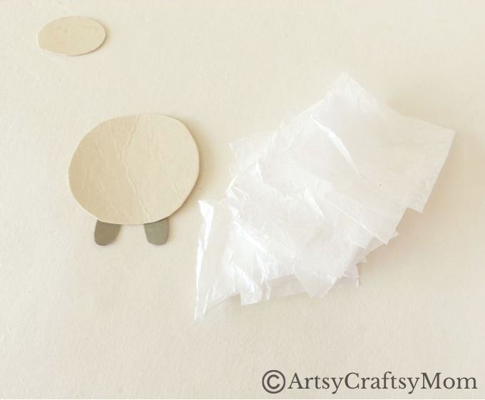 Crumpling paper is fun, & this crumpled paper sheep craft is a great way to use up all those crumpled bits! Easy fine motor exercise for young kids.