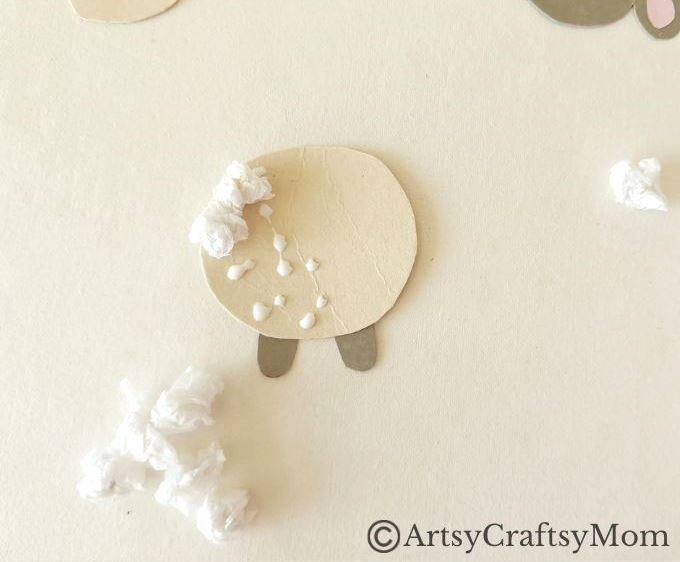 Crumpling paper is fun, & this crumpled paper sheep craft is a great way to use up all those crumpled bits! Easy fine motor exercise for young kids.