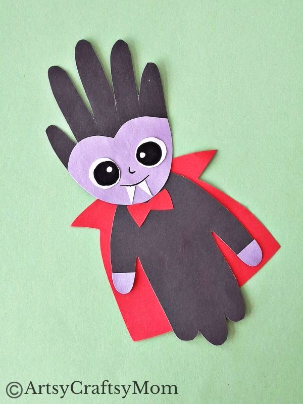 If you're looking for a Creative Handprint Dracula Craft for Halloween, we got you! This one features a dracula with handprint hair and a cute smile!