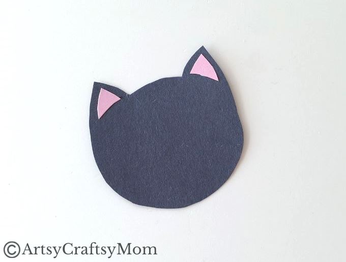 If you're looking for a black cat craft this Halloween, you'll love this cute handprint black cat craft, made entirely out of colored craft paper!