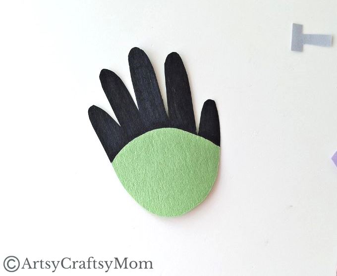 This handprint Frankenstein craft is super easy for kids to make - it's not at all like Dr. Frankenstein struggling to put together his monster!