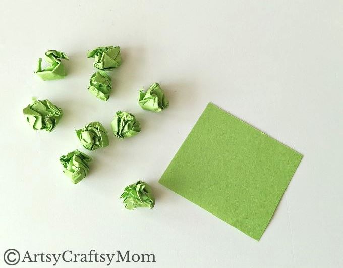 This crumpled paper Christmas tree ornament is the easiest Christmas craft for kids to try this holiday season - all you need is lots of green paper!