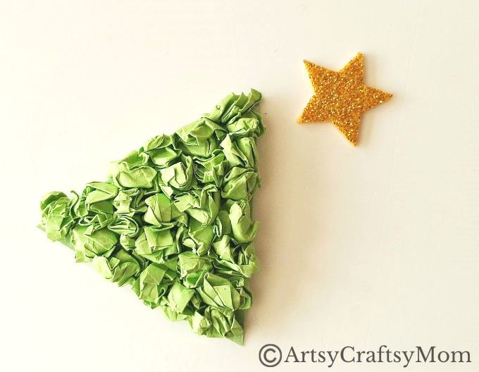 This crumpled paper Christmas tree ornament is the easiest Christmas craft for kids to try this holiday season - all you need is lots of green paper!