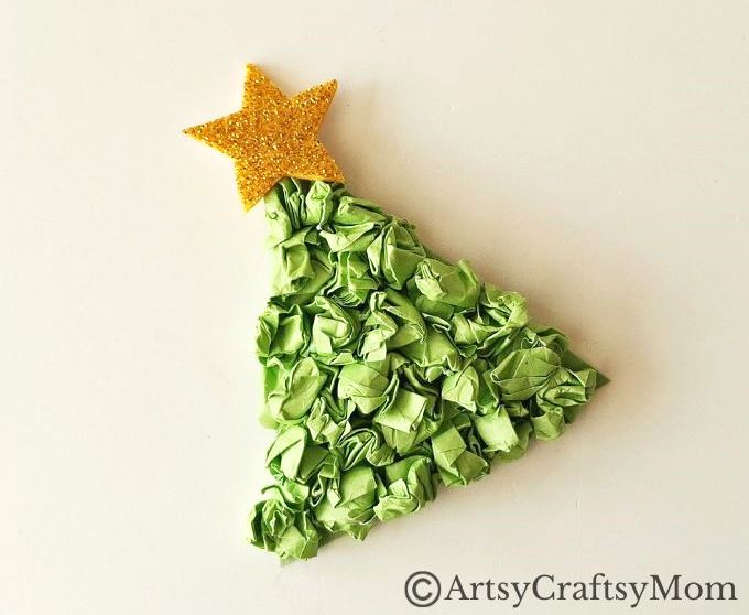 This crumpled paper Christmas tree ornament is the easiest Christmas craft for kids to try this holiday season - all you need is lots of green paper!