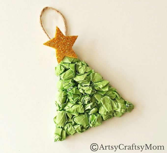 This crumpled paper Christmas tree ornament is the easiest Christmas craft for kids to try this holiday season - all you need is lots of green paper!
