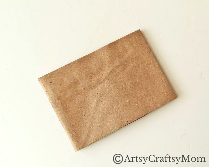 Can you turn a paper bag into a Christmas ornament? Well, this paper bag star ornament craft certainly proves it can be done without much effort!
