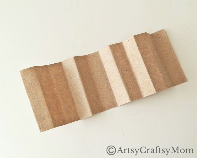 Can you turn a paper bag into a Christmas ornament? Well, this paper bag star ornament craft certainly proves it can be done without much effort!