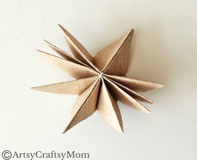 Can you turn a paper bag into a Christmas ornament? Well, this paper bag star ornament craft certainly proves it can be done without much effort!