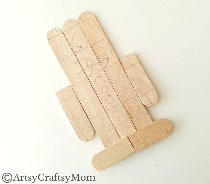 Kids will love creating this popsicle stick Nutcracker craft out of craft sticks and paints! Add some string and use it to decorate your tree!