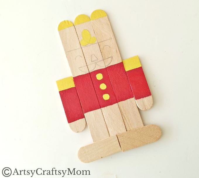 Kids will love creating this popsicle stick Nutcracker craft out of craft sticks and paints! Add some string and use it to decorate your tree!
