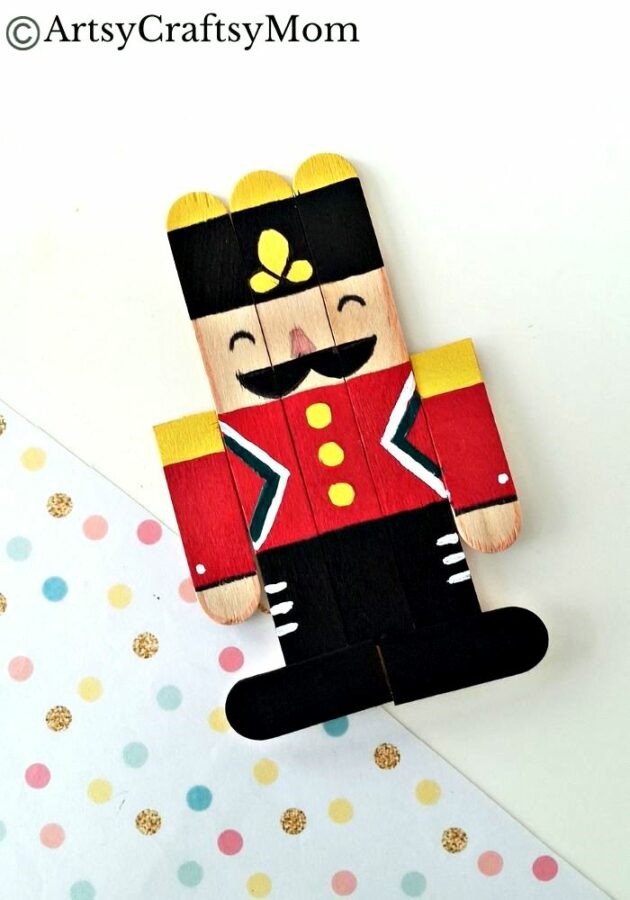 Kids will love creating this popsicle stick Nutcracker craft out of craft sticks and paints! Add some string and use it to decorate your tree!