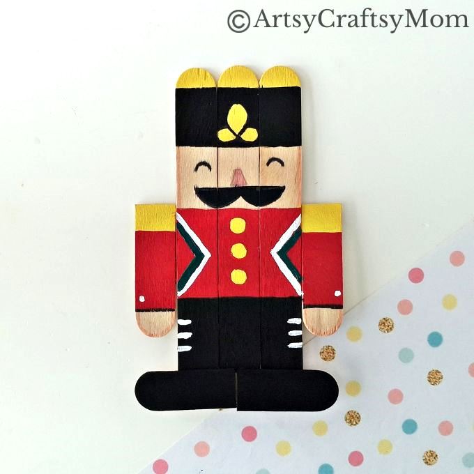 Kids will love creating this popsicle stick Nutcracker craft out of craft sticks and paints! Add some string and use it to decorate your tree!