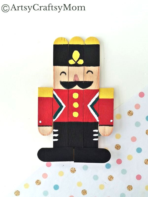 Kids will love creating this popsicle stick Nutcracker craft out of craft sticks and paints! Add some string and use it to decorate your tree!