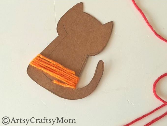 Colorful Yarn-Wrapped Cat Craft for Kids 6 This colorful yarn wrapped cat craft is great for young kids to practice their fine motor skills while also keeping them focused for a bit!