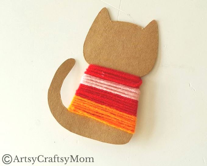 Colorful Yarn-Wrapped Cat Craft for Kids 9 This colorful yarn wrapped cat craft is great for young kids to practice their fine motor skills while also keeping them focused for a bit!