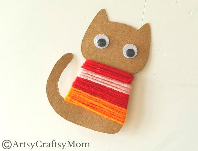 Colorful Yarn-Wrapped Cat Craft for Kids 10 This colorful yarn wrapped cat craft is great for young kids to practice their fine motor skills while also keeping them focused for a bit!