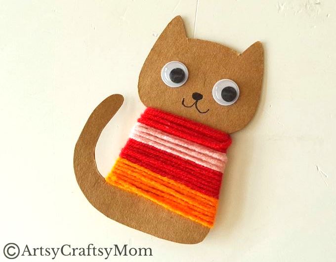 Colorful Yarn-Wrapped Cat Craft for Kids 11 This colorful yarn wrapped cat craft is great for young kids to practice their fine motor skills while also keeping them focused for a bit!