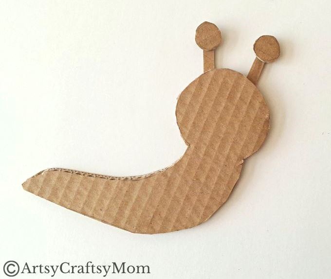 Here's a beautiful yarn-wrapped snail craft for kids to help exercise their fine motor skills and also help them focus intently on a task for a while!