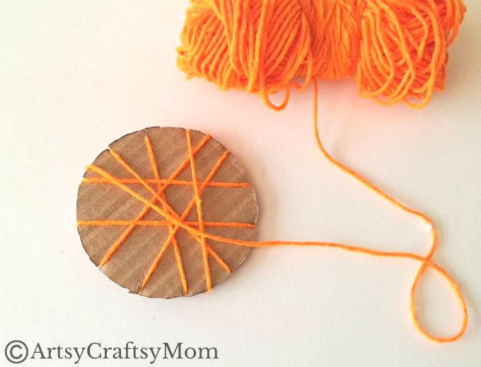 Here's a beautiful yarn-wrapped snail craft for kids to help exercise their fine motor skills and also help them focus intently on a task for a while!