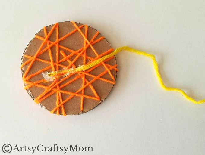Here's a beautiful yarn-wrapped snail craft for kids to help exercise their fine motor skills and also help them focus intently on a task for a while!