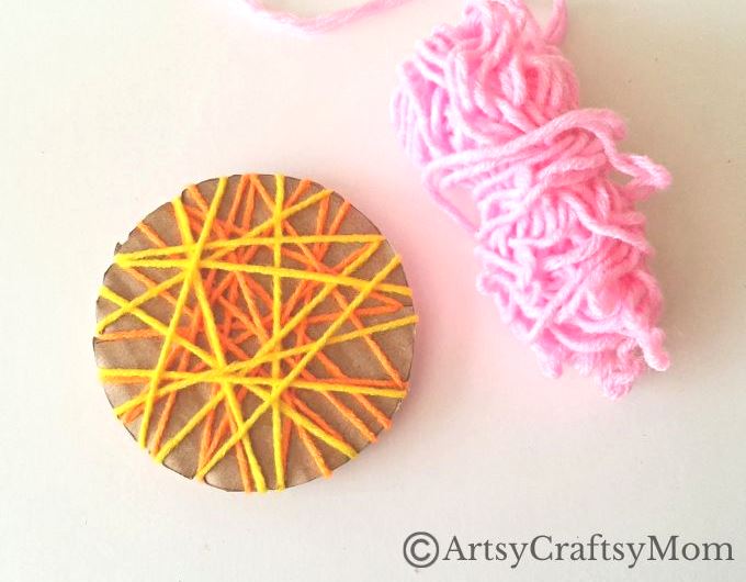 Here's a beautiful yarn-wrapped snail craft for kids to help exercise their fine motor skills and also help them focus intently on a task for a while!