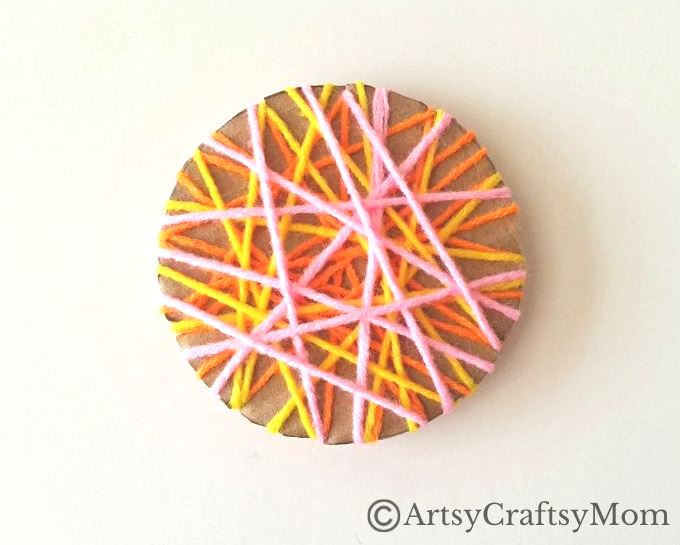 Here's a beautiful yarn-wrapped snail craft for kids to help exercise their fine motor skills and also help them focus intently on a task for a while!