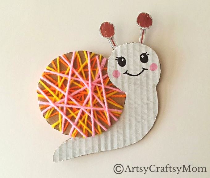 Here's a beautiful yarn-wrapped snail craft for kids to help exercise their fine motor skills and also help them focus intently on a task for a while!