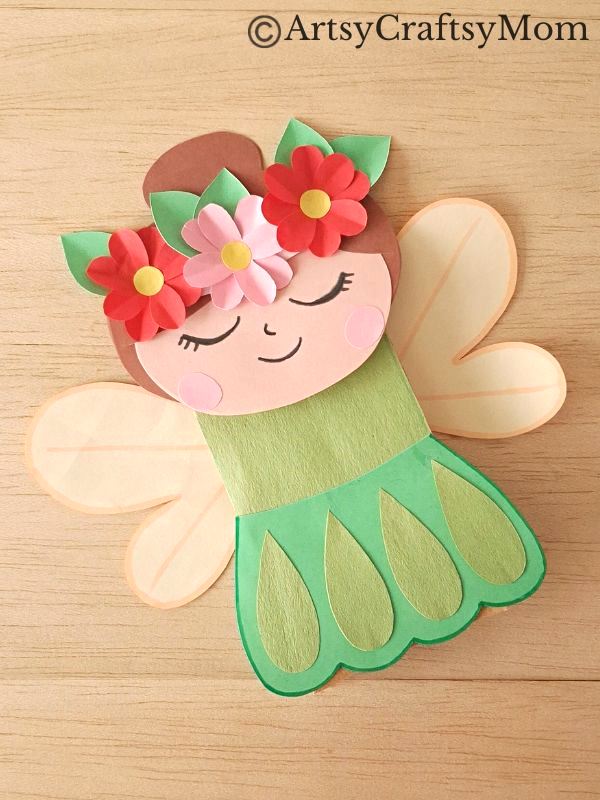 Let's welcome spring with a pretty paper bag spring fairy puppet craft! This fairy reminds us of flowers, greenery & everything we love about spring!