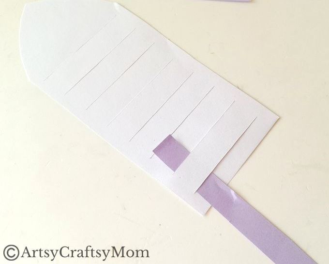 New to paper weaving? This colorful woven paper rocket craft is the perfect choice for little kids starting out, without overwhelming them!