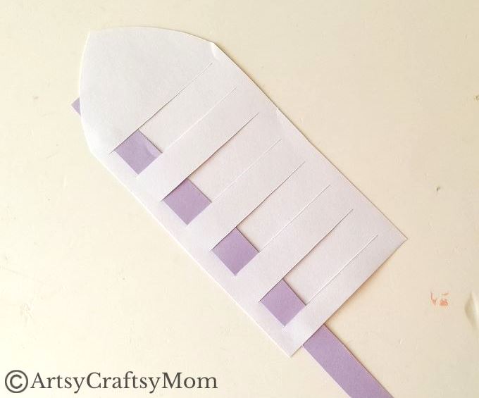 New to paper weaving? This colorful woven paper rocket craft is the perfect choice for little kids starting out, without overwhelming them!