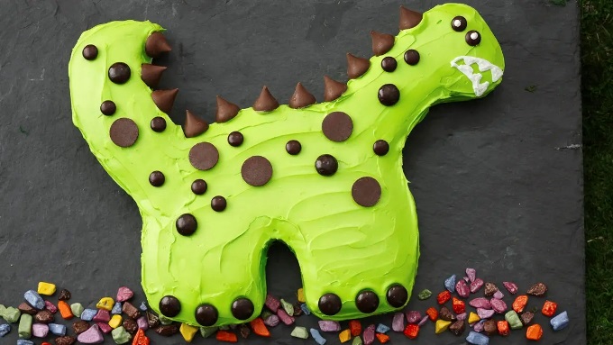 Planning a dinosaur-themed party for kids? Take a look at the coolest ideas for decorations, printables, games, party foods, cakes and more!