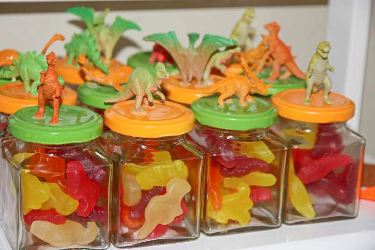 Planning a dinosaur-themed party for kids? Take a look at the coolest ideas for decorations, printables, games, party foods, cakes and more!