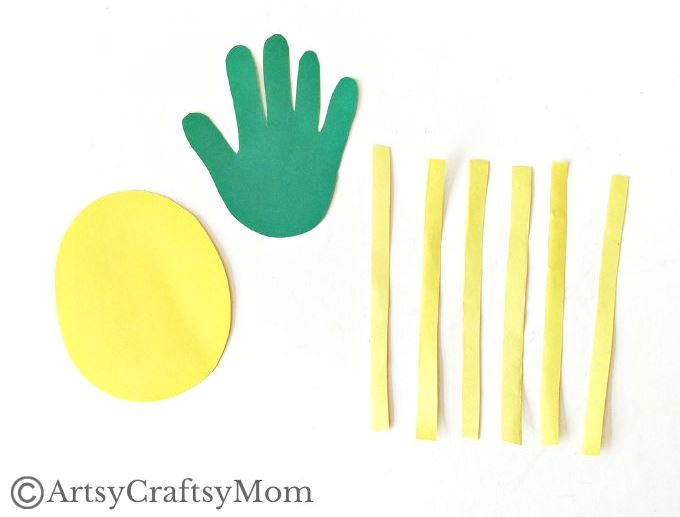 This juicy handprint pineapple craft for kids is perfect for the summer and looks good enough to eat! Ideal project for young kids and preschoolers!