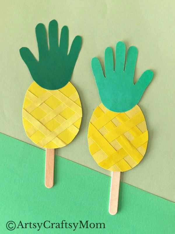 This juicy handprint pineapple craft for kids is perfect for the summer and looks good enough to eat! Ideal project for young kids and preschoolers!