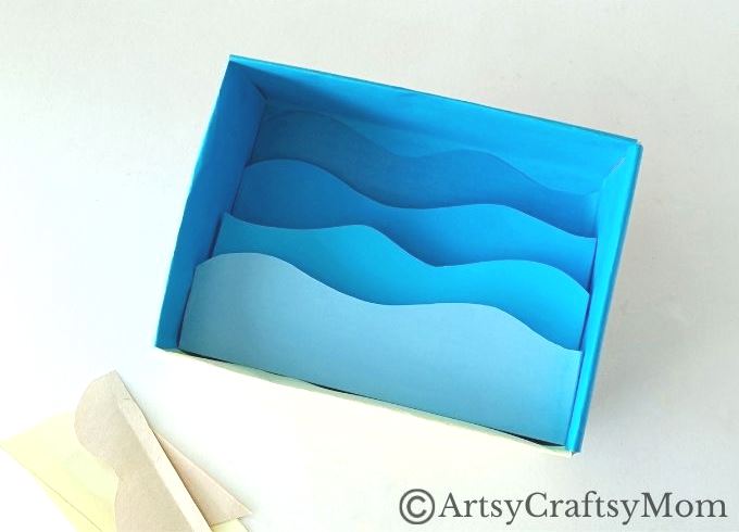 Celebrate the wonderful diversity of ocean life as you make this beautiful cardboard box underwater diorama, filled with colorful fish and plants!