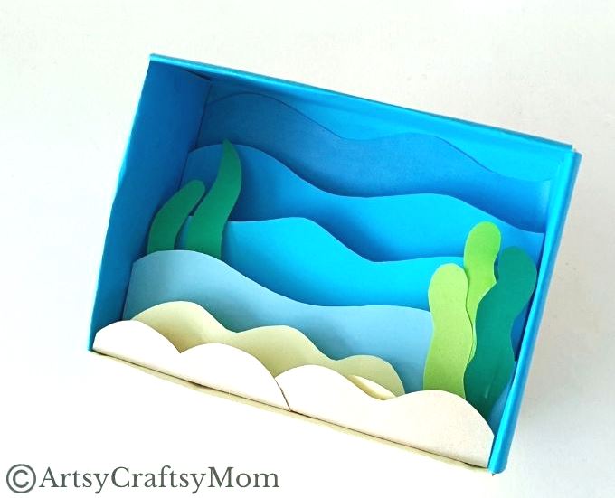 Celebrate the wonderful diversity of ocean life as you make this beautiful cardboard box underwater diorama, filled with colorful fish and plants!