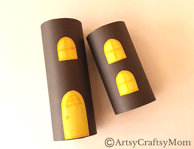 Gather all the empty cardboard tubes you can find - we're going to use them and some craft paper to make a toilet paper roll haunted house craft!