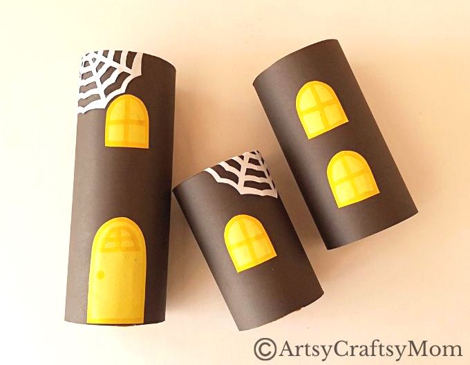 Gather all the empty cardboard tubes you can find - we're going to use them and some craft paper to make a toilet paper roll haunted house craft!