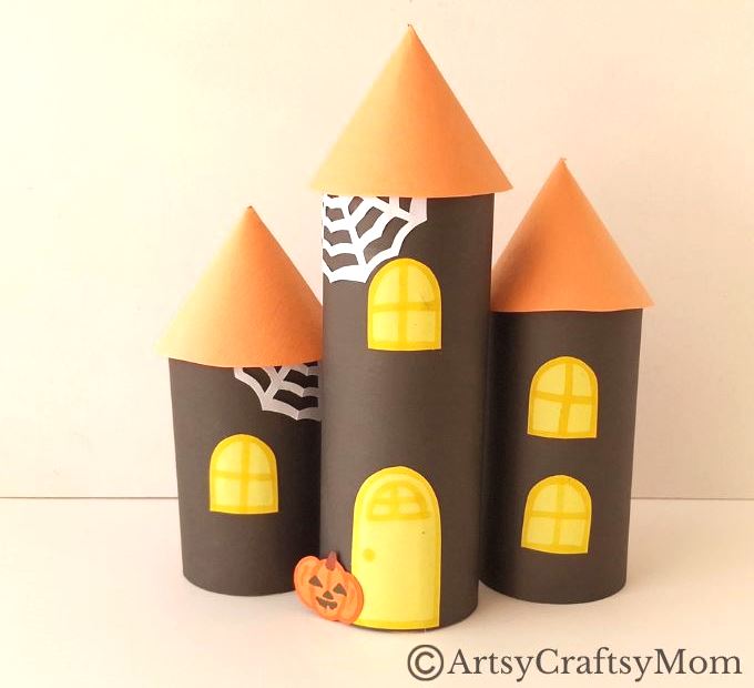 Gather all the empty cardboard tubes you can find - we're going to use them and some craft paper to make a toilet paper roll haunted house craft!